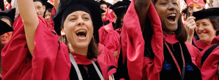 A crowd of students cheer at Commencement