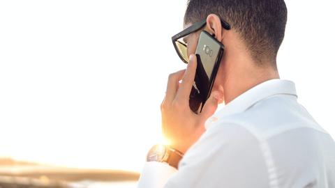 a man using a mobile phone