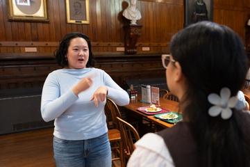 A woman using hand gestures