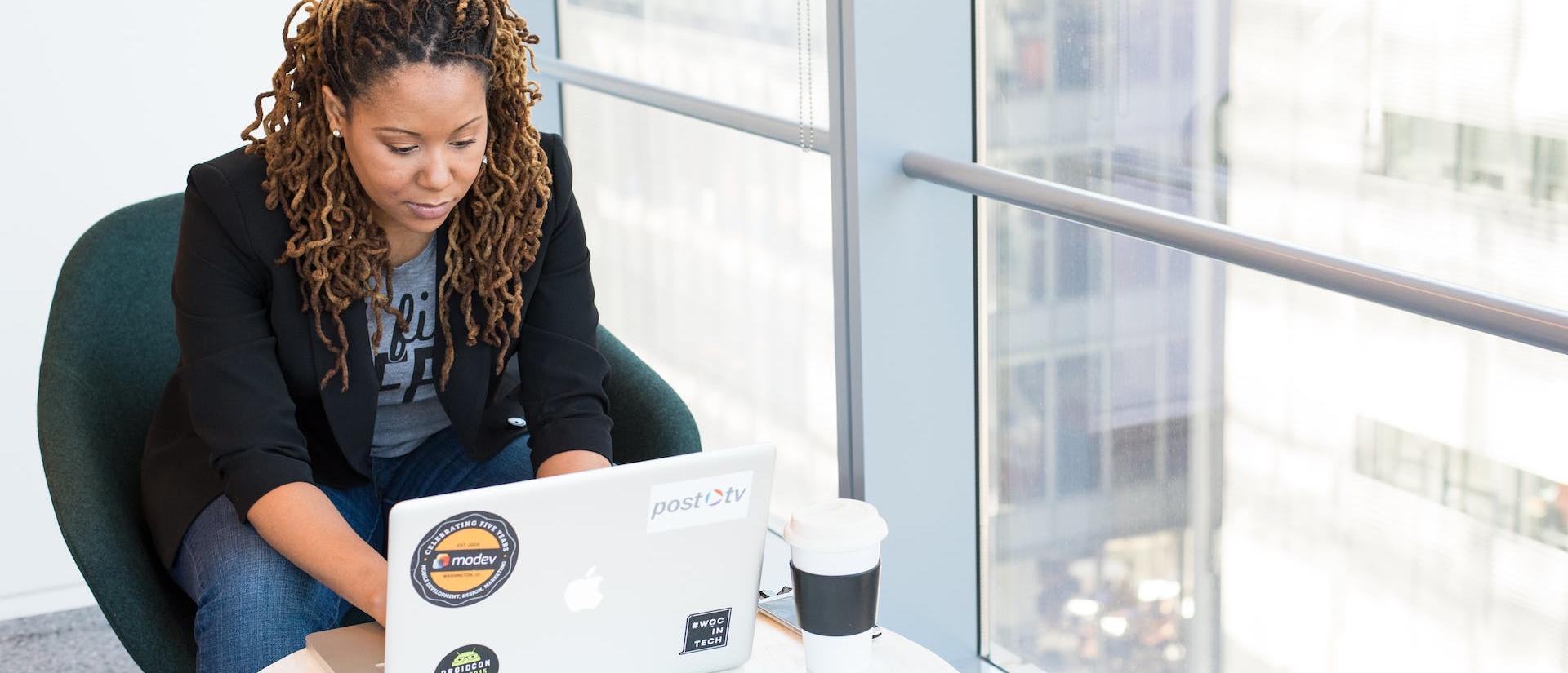 Woman sitting in front of a laptop computer