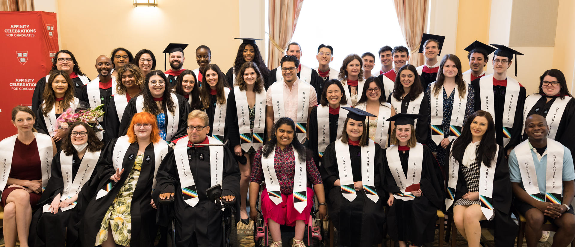 a group of people celebrating their first disability affinity graduation celebration